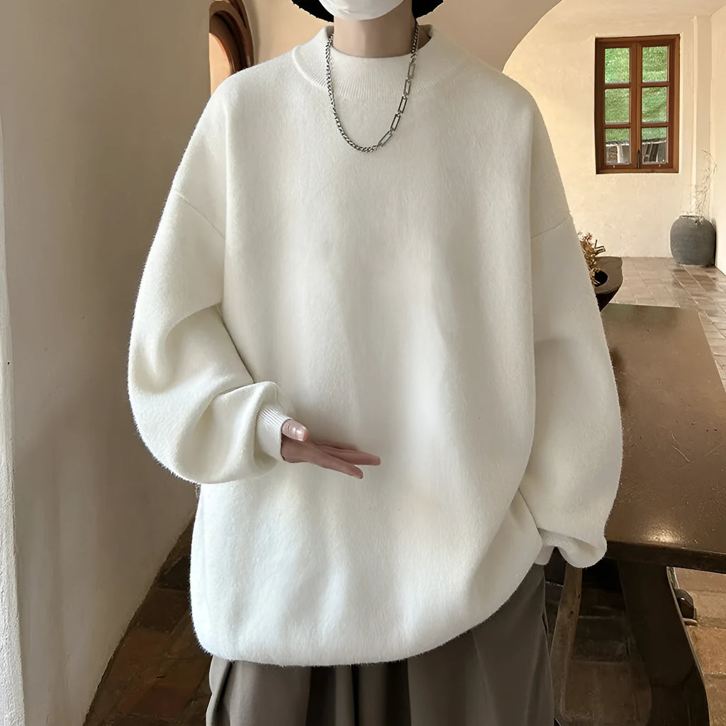 Men's loose fit round neck pullover sweater in a solid colour on a hanger.