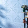 Light blue plants and flowers pattern on a large square self-adhesive foam wall sticker with a three-dimensional texture.