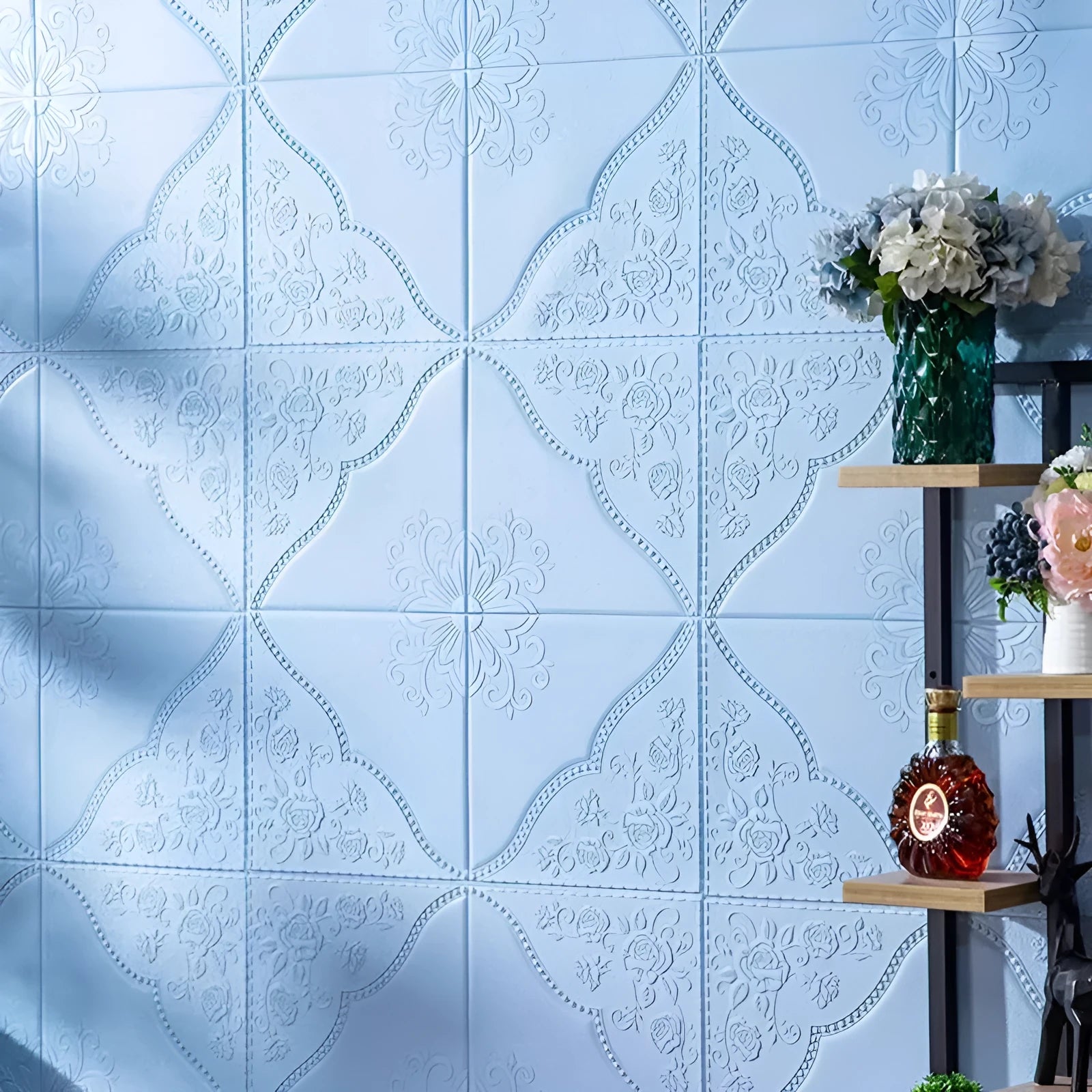 Light blue plants and flowers pattern on a large square self-adhesive foam wall sticker with a three-dimensional texture.