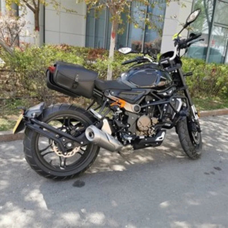 Black PU leather motorcycle swingarm bag mounted on a Harley Sportster side.