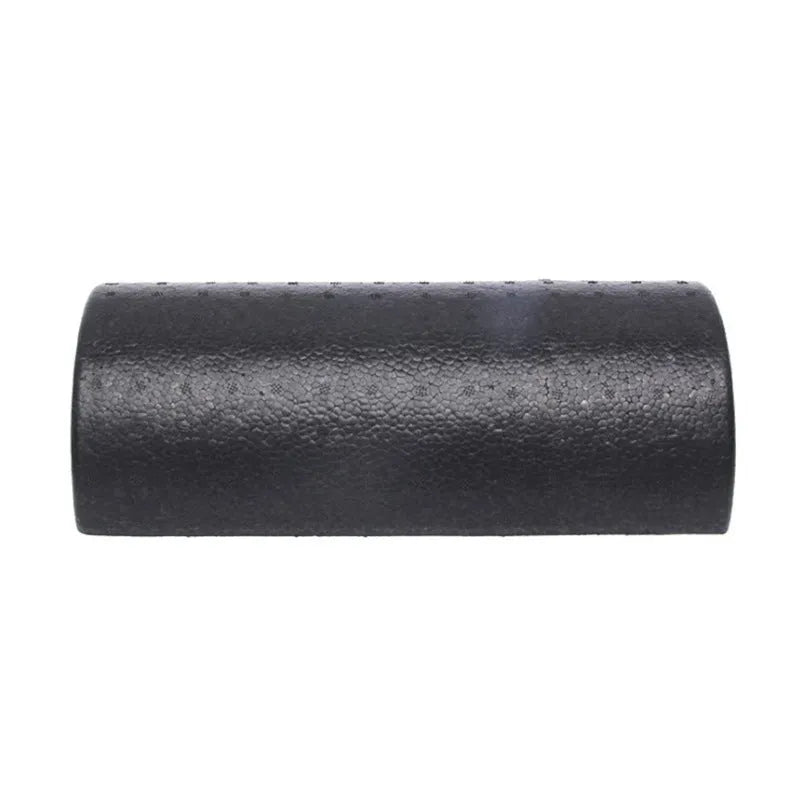 Black semi-circular EPP foam yoga roller 30cm on floor for muscle massage and stretching