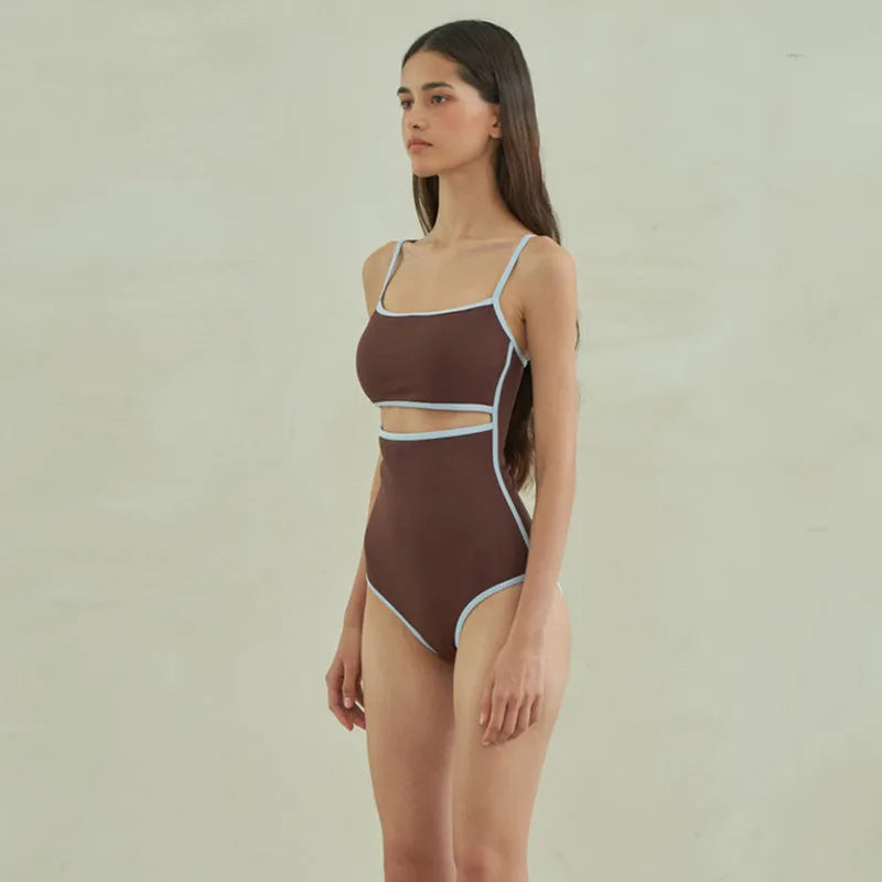 Brown women's triangle top one-piece swimsuit on hanger showing front design