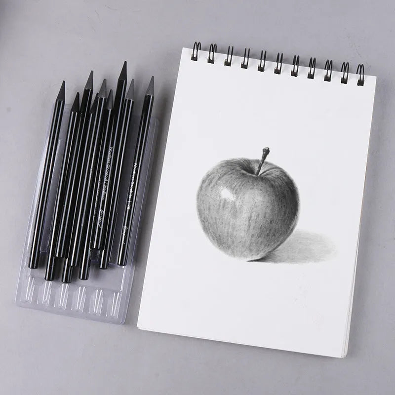 Set of nine graphite and carbonised drawing pencils in wooden casings on a suction card.