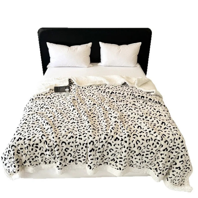 Double-layer cationic leopard jacquard taffeta blanket showing animal print pattern design