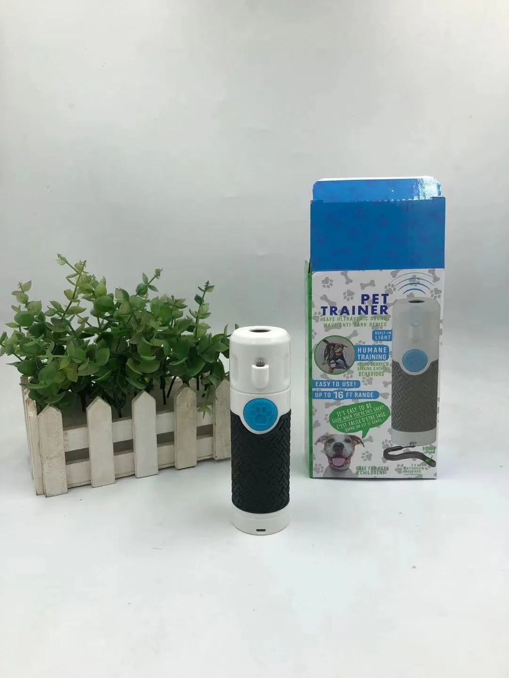 White handheld ultrasonic dog trainer device for bark control with ABS plastic construction