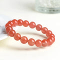 Natural cherry red agate bracelet with polished scattered beads, shown in a single circle style.