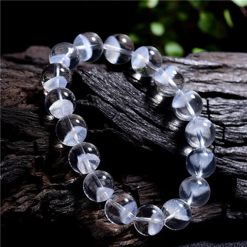Women's white crystal ghost bracelet with a ruyi element, showing adjustable bead sizes.