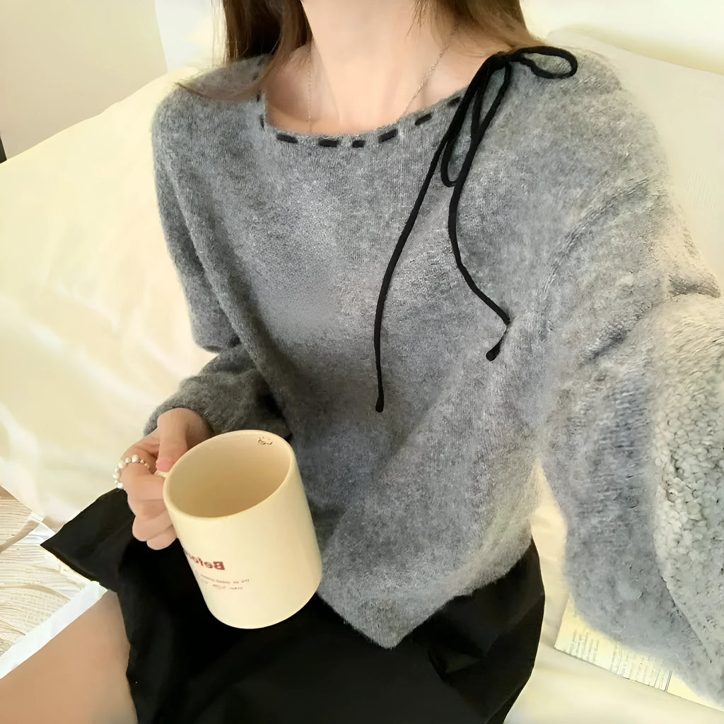 Women's loose-fitting black knitwear pullover jumper made from regenerated cellulose fibre.