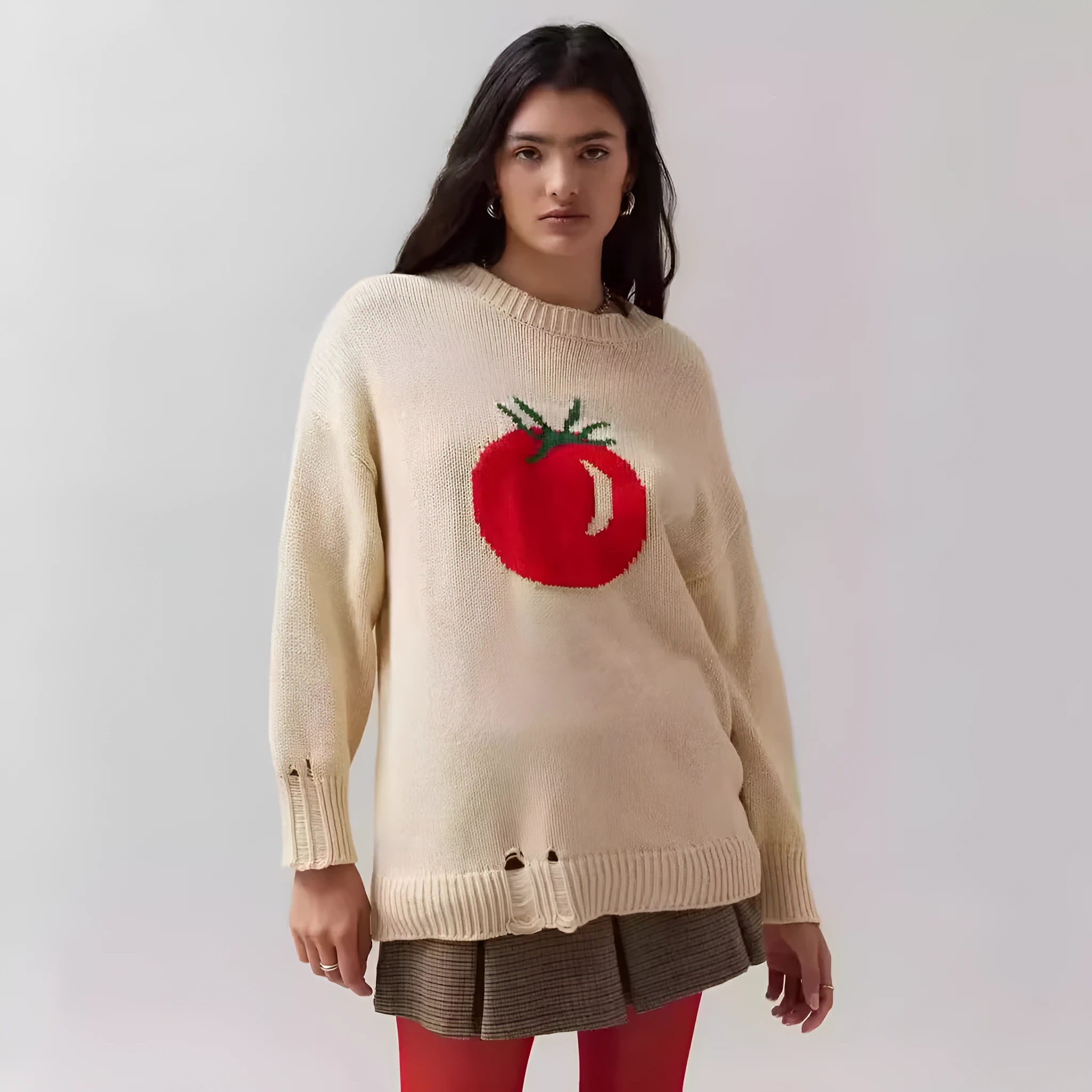Women's beige acrylic jacquard loose-fitting pullover sweater with round neck and long sleeves.