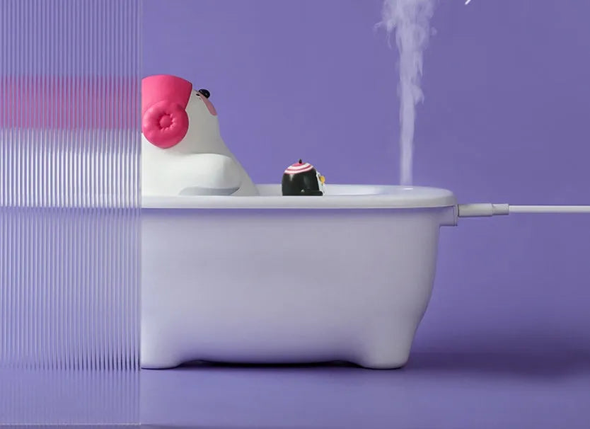 White USB air humidifier with 550ml water tank showing mist output and control buttons
