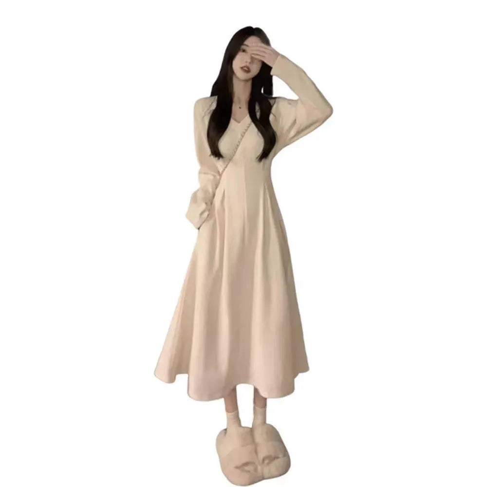 Women's knitted V-neck dress with princess sleeves and long skirt in Milky White or Black.