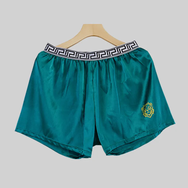 Solid colour men's loose fit knitted polyester boxer shorts in silver grey on white background