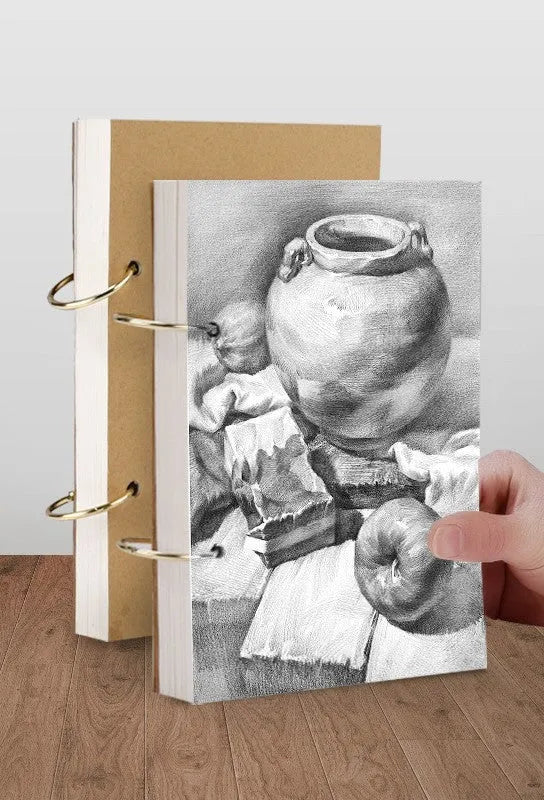 8K thickened sketchbook open showing coil binding and marker illustration on specialised paper