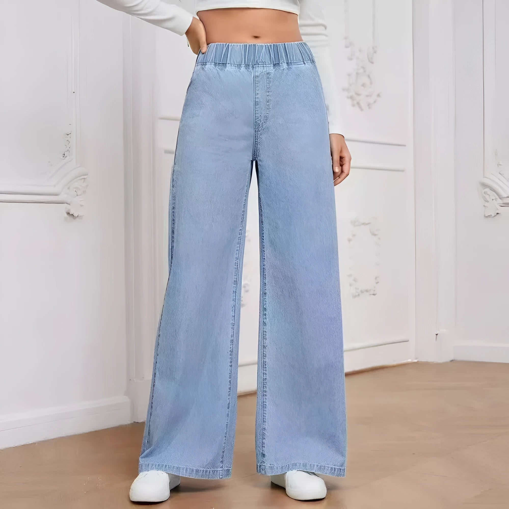 Light blue washed wide-leg denim jeans with straight-leg cut and mid-waist design