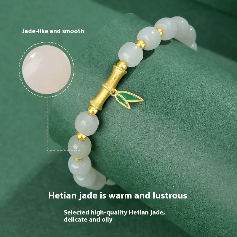 S925 sterling silver bracelet with round Hetian jade beads and bamboo leaf charms.