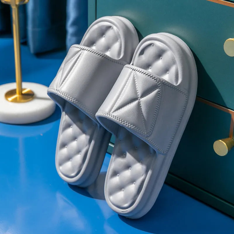 Pair of thick-sole EVA bathroom sandals in a chosen colour, showing soft upper and substantial non-slip base.