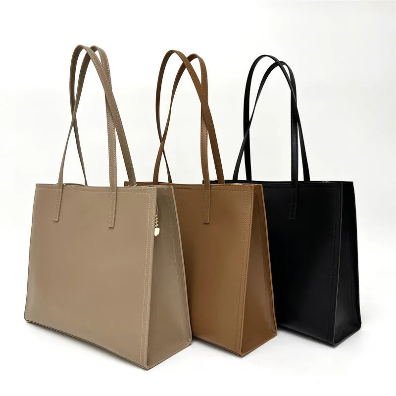 Genuine leather women's one shoulder handbag in a horizontal square shape showing internal compartments.