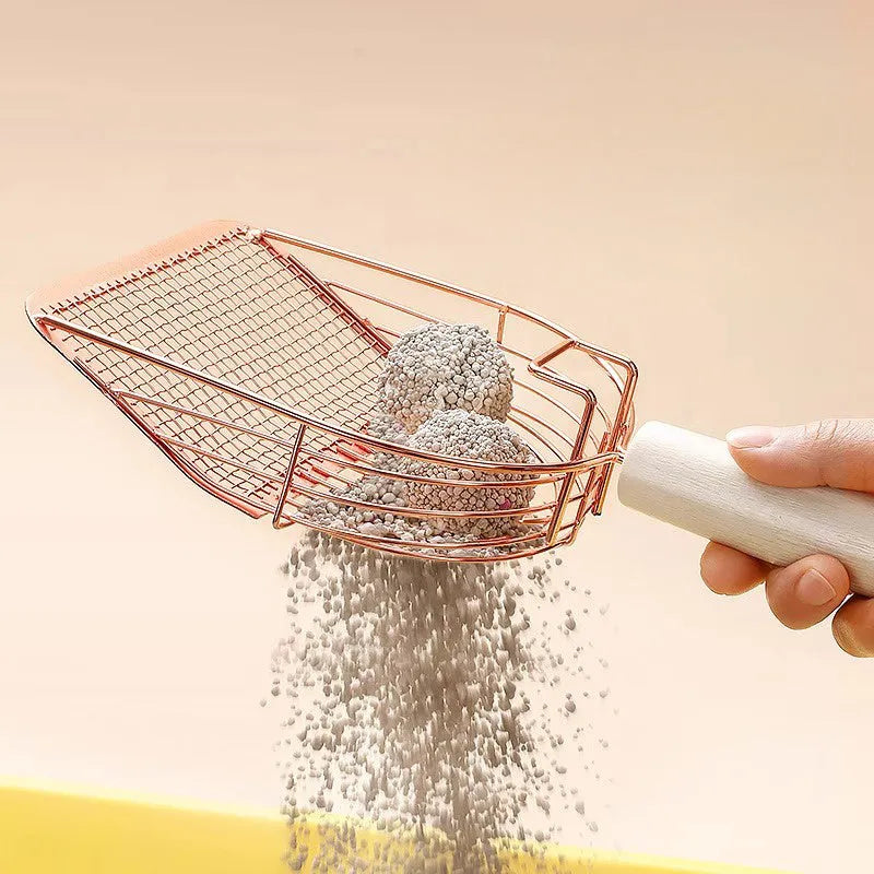 Stainless steel cat litter scoop with wooden handle showing screened design for efficient waste removal