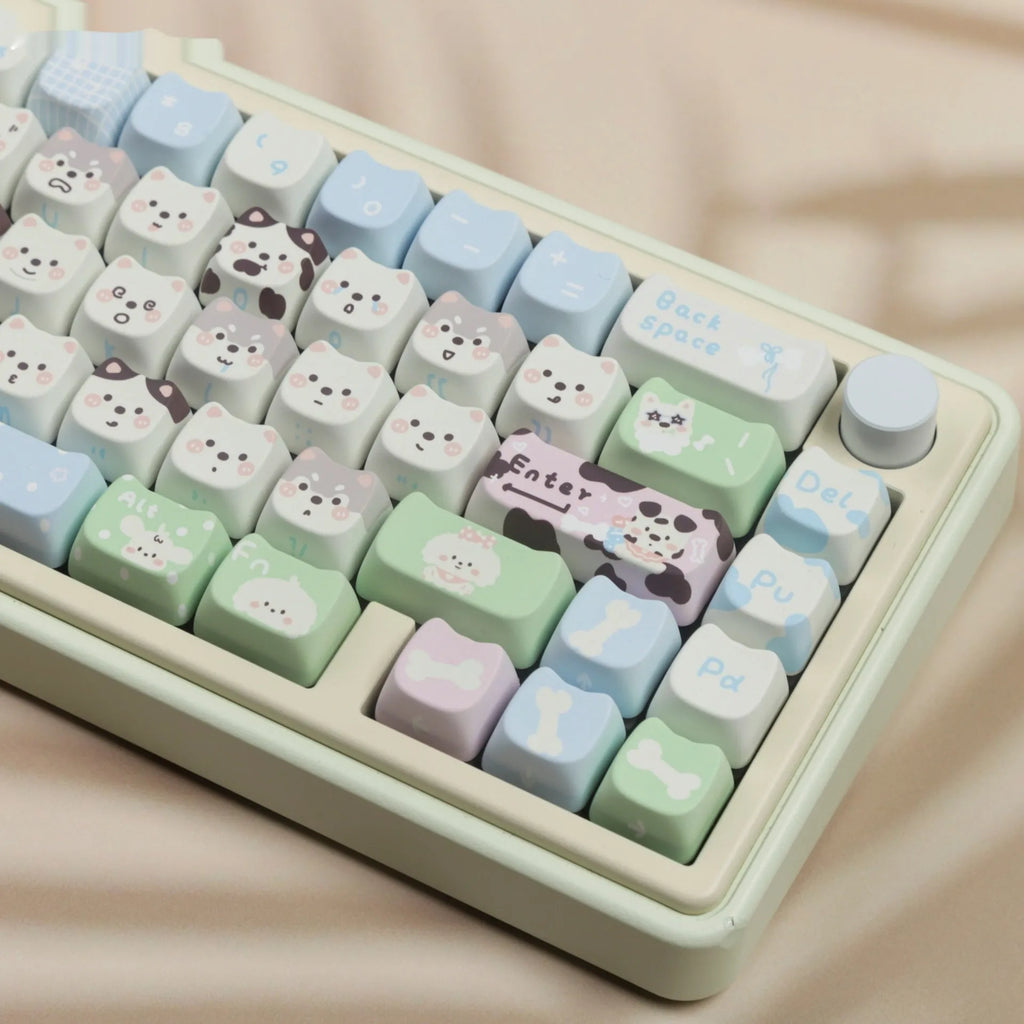 Full set of colourful PBT keyboard keycaps with sublimated cute puppy and cat designs laid out.