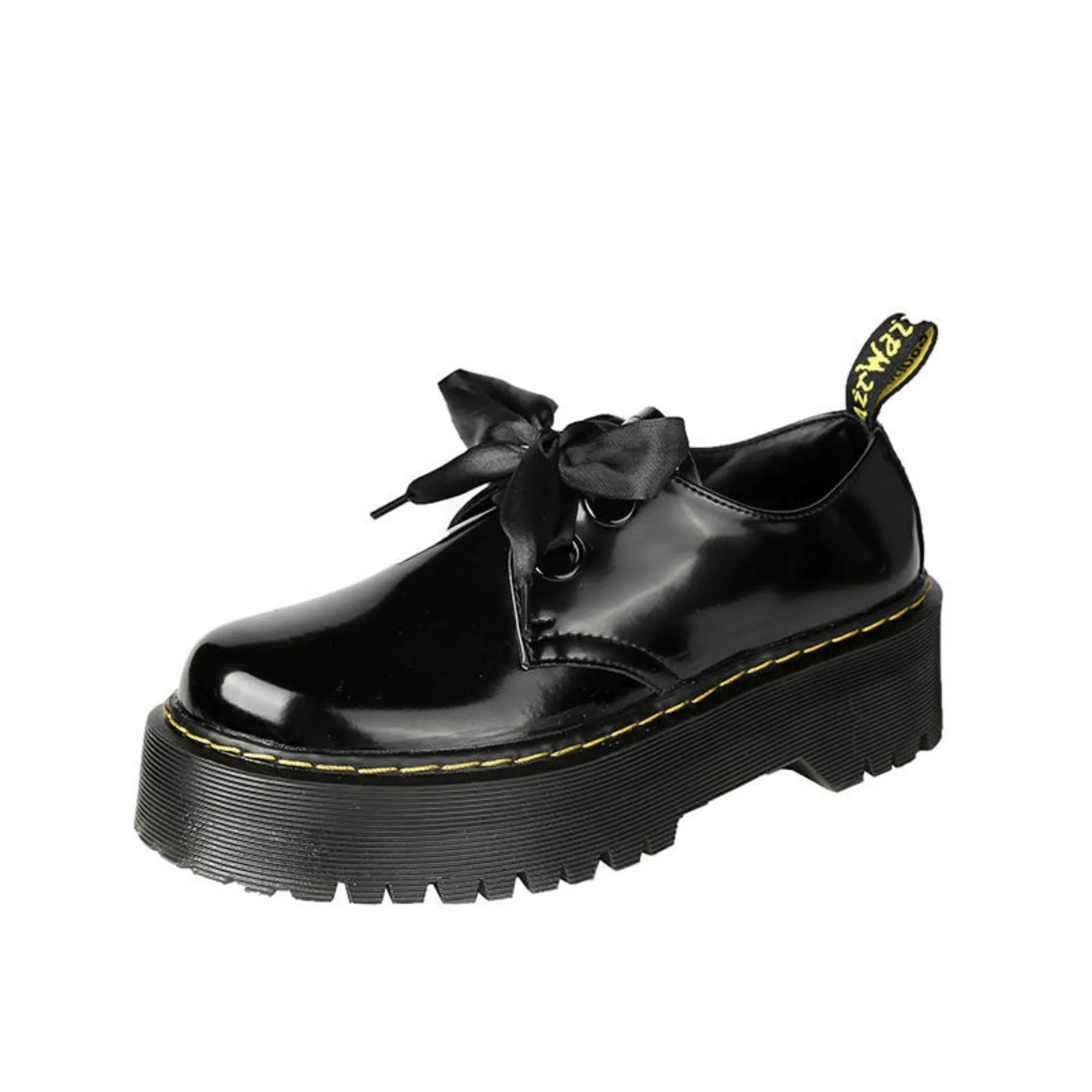 Black women's lace-up shoes with a thick sole, ribbon detail, and cross straps.