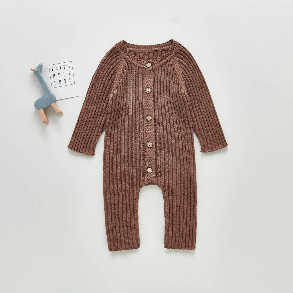 Baby long-sleeved knitted jumpsuit romper pullover in beige, size 80cm, lying flat on a white background