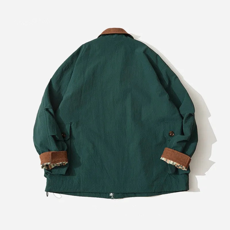 Green and apricot contrast colour casual jacket with side seam pockets on a hanger