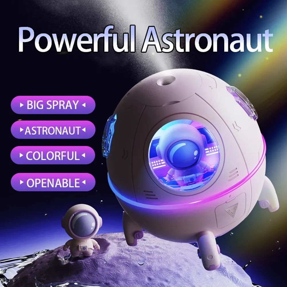 Purple astronaut space capsule USB humidifier with colourful LED lights on desktop