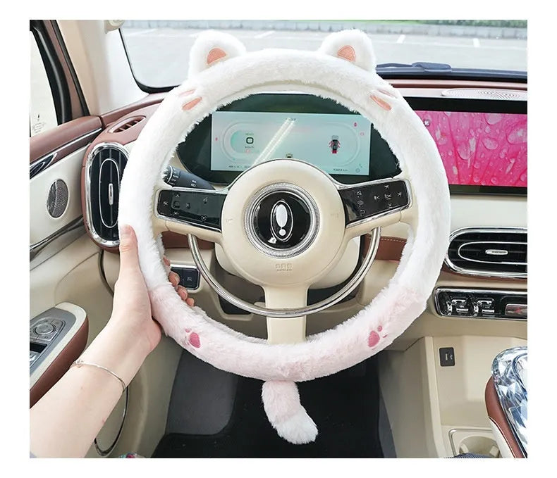 Plush rabbit fur winter steering wheel cover with cute embroidered panda design, shown fitted on a car steering wheel.