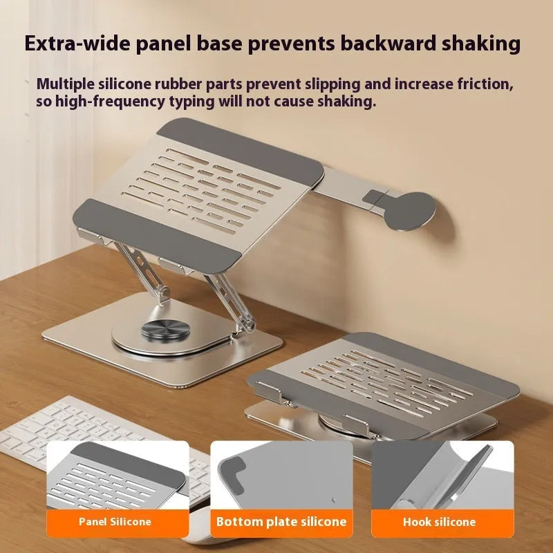 Silver carbon steel laptop stand with rotatable base and a side-mounted magnetic phone holder on a desk.