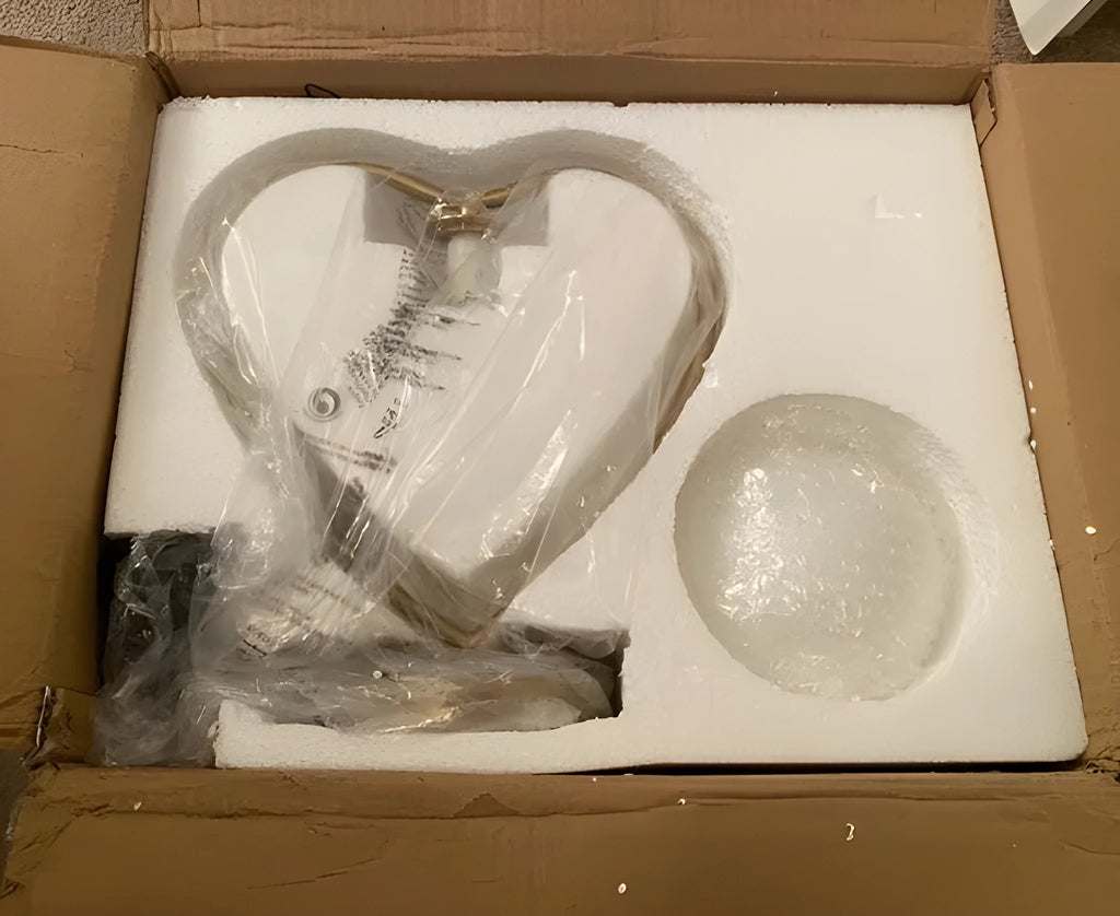 Heart shaped decorative LED lamp providing a warm glow on a table.