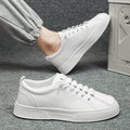 Men's black and white low top sports shoes with mesh panels and synthetic leather upper.