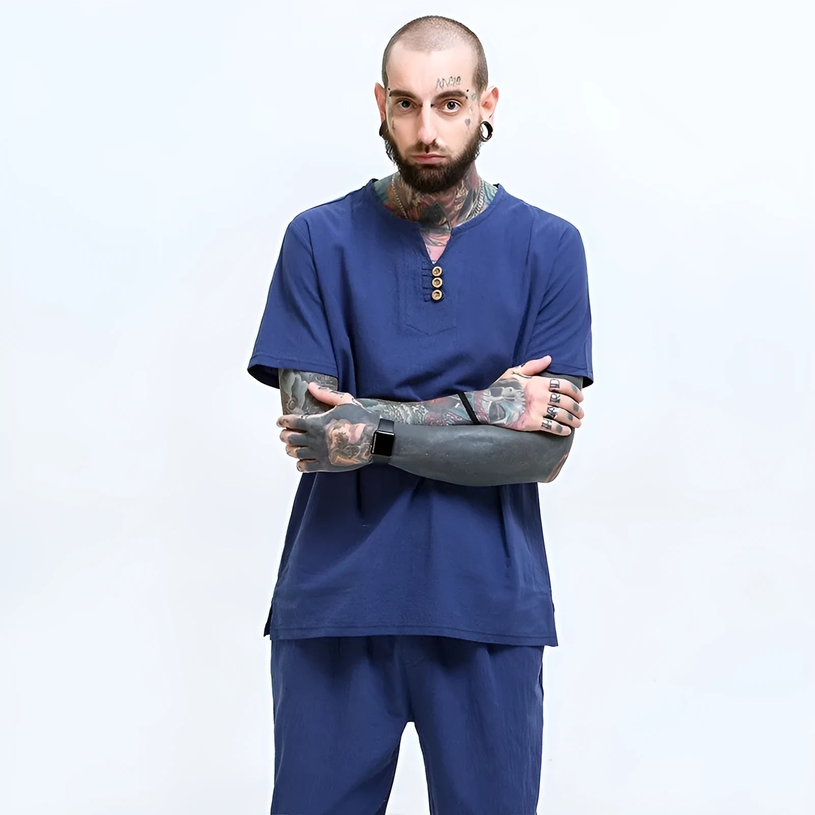 Man wearing a loose grey cotton and linen short-sleeve T-shirt, casual fit.