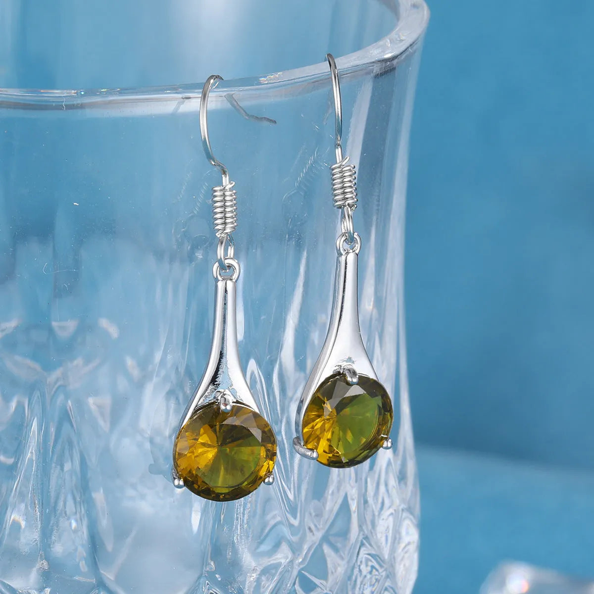 Women's olive green topaz earrings with water drop shape and retro minimalist design
