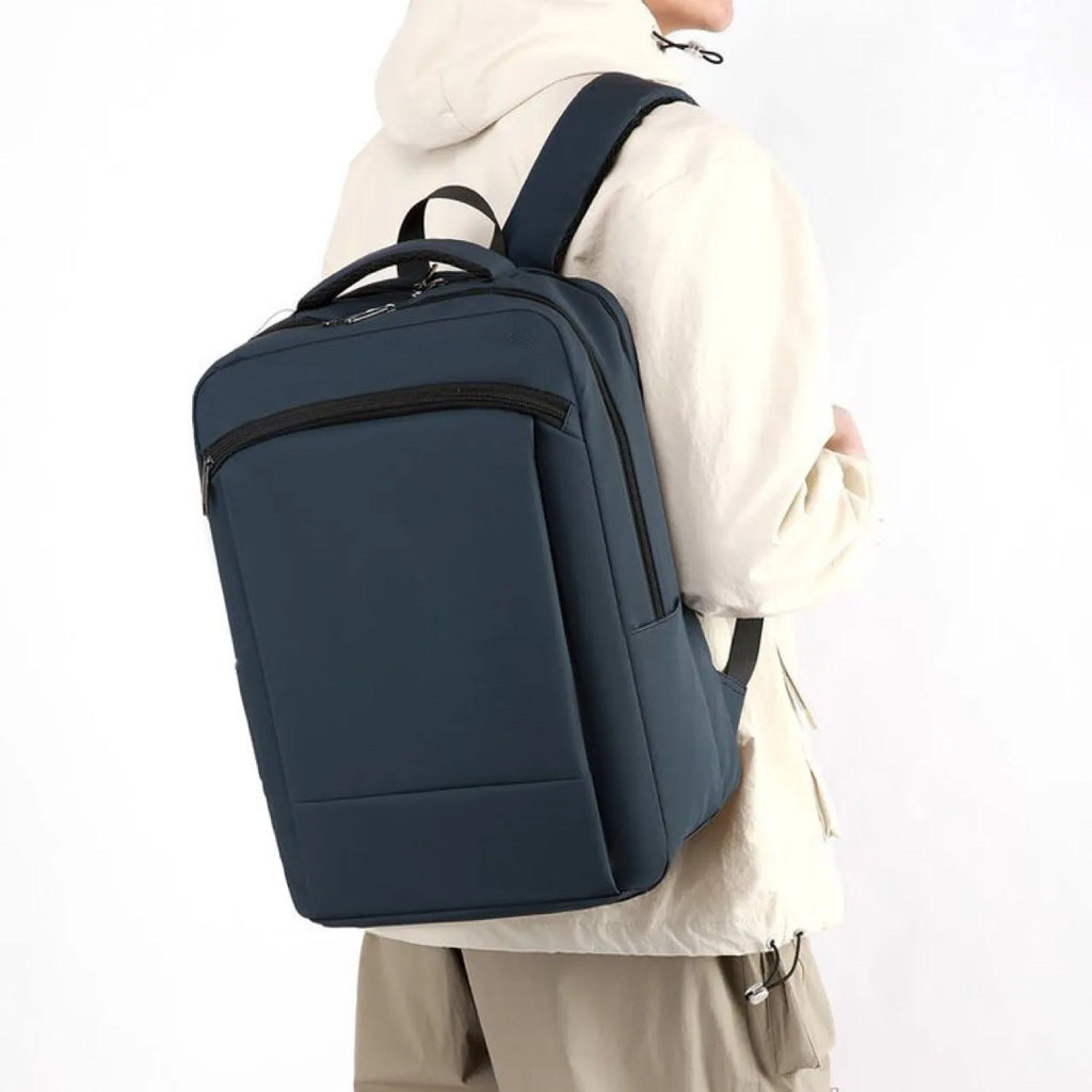Large capacity waterproof business commute backpack in dark blue with curved shoulder strap