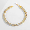 Women's simple diamond studded bracelet in gold finish with 4mm band width on white background