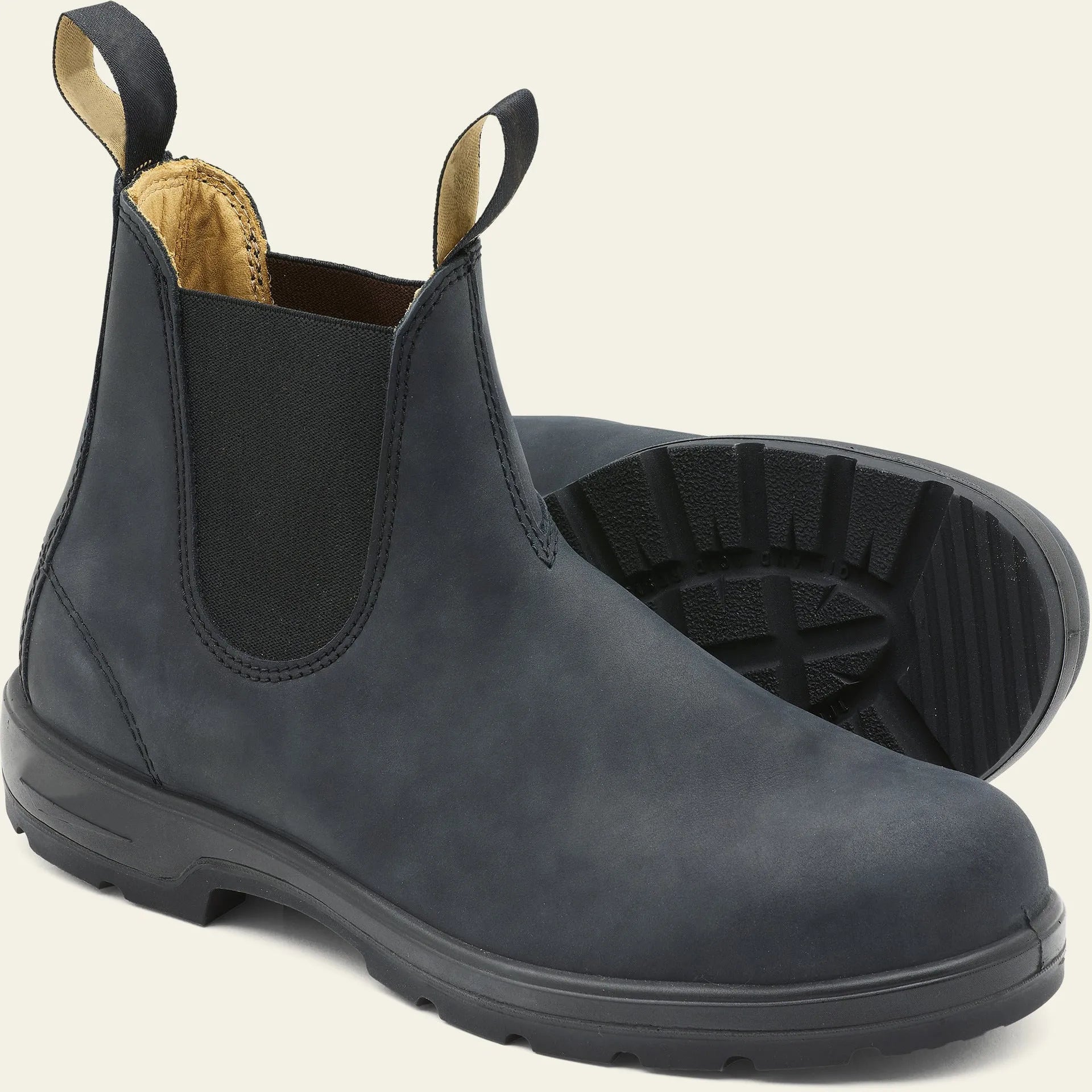 Vintage brown unisex Chelsea boots with car stitching and a low horse hoof heel.