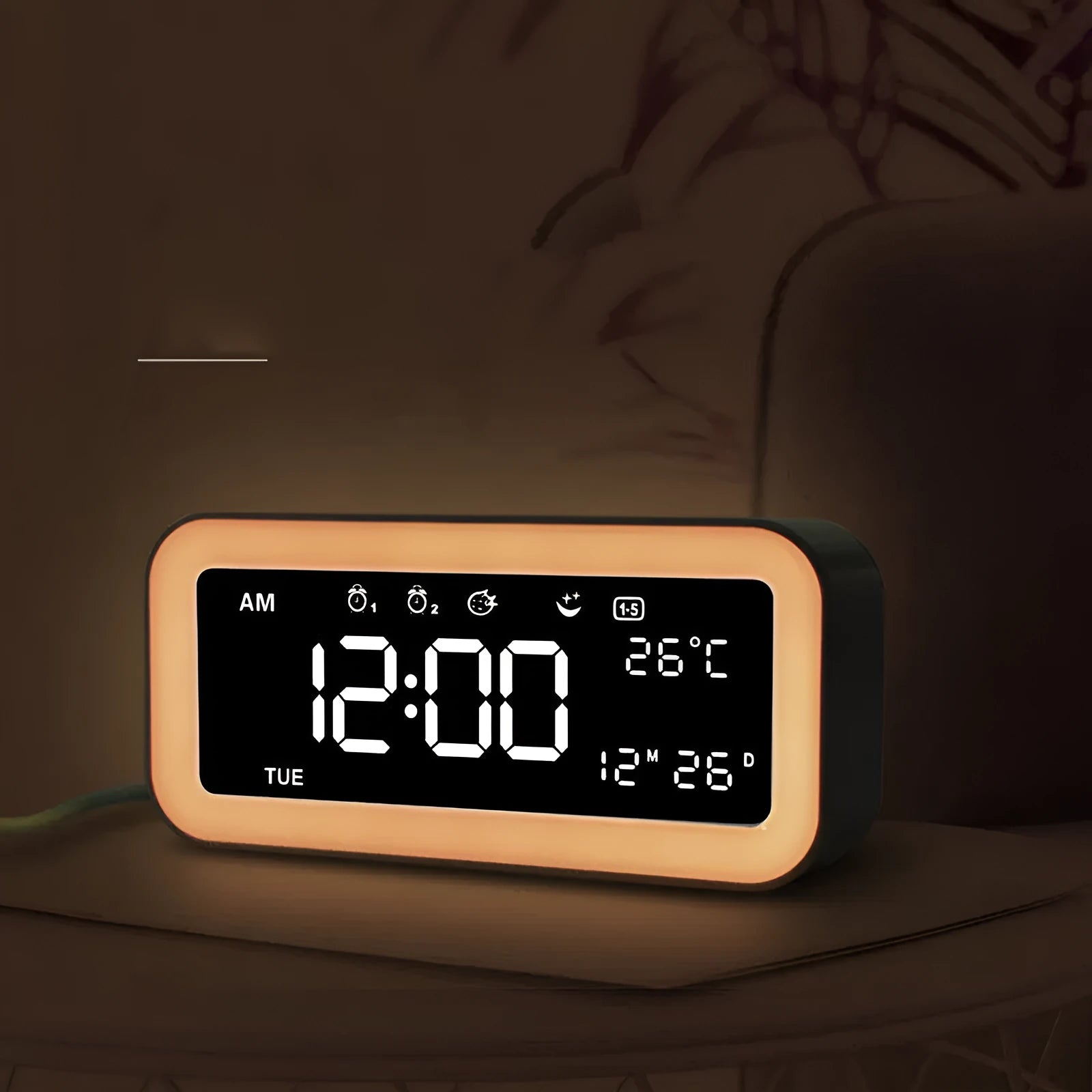 Blue rectangular LED alarm clock with digital display on a table.
