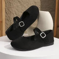Black canvas fisherman shoes with low-top design and rubber soles