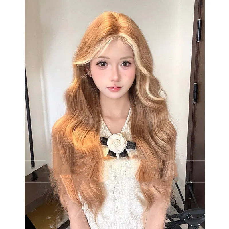 Long curly synthetic wig in American highlight gold colour with a natural one-word lace front.