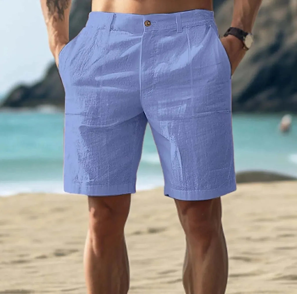 Men's mid-length cotton casual pants in dark blue with a button-fly front.