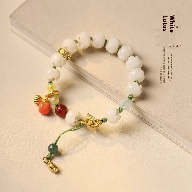 White jade Bodhi bracelet with hand-woven rope, lotus beads, and large pumpkin beads on an open ring design.