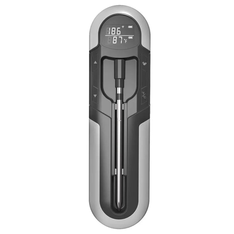 Blue portable Bluetooth barbecue thermometer with magnet design and LCD screen on a metal grill surface