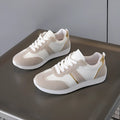 Women's casual flat sports shoes in grey with fabric canvas upper and PVC sole, low-top design