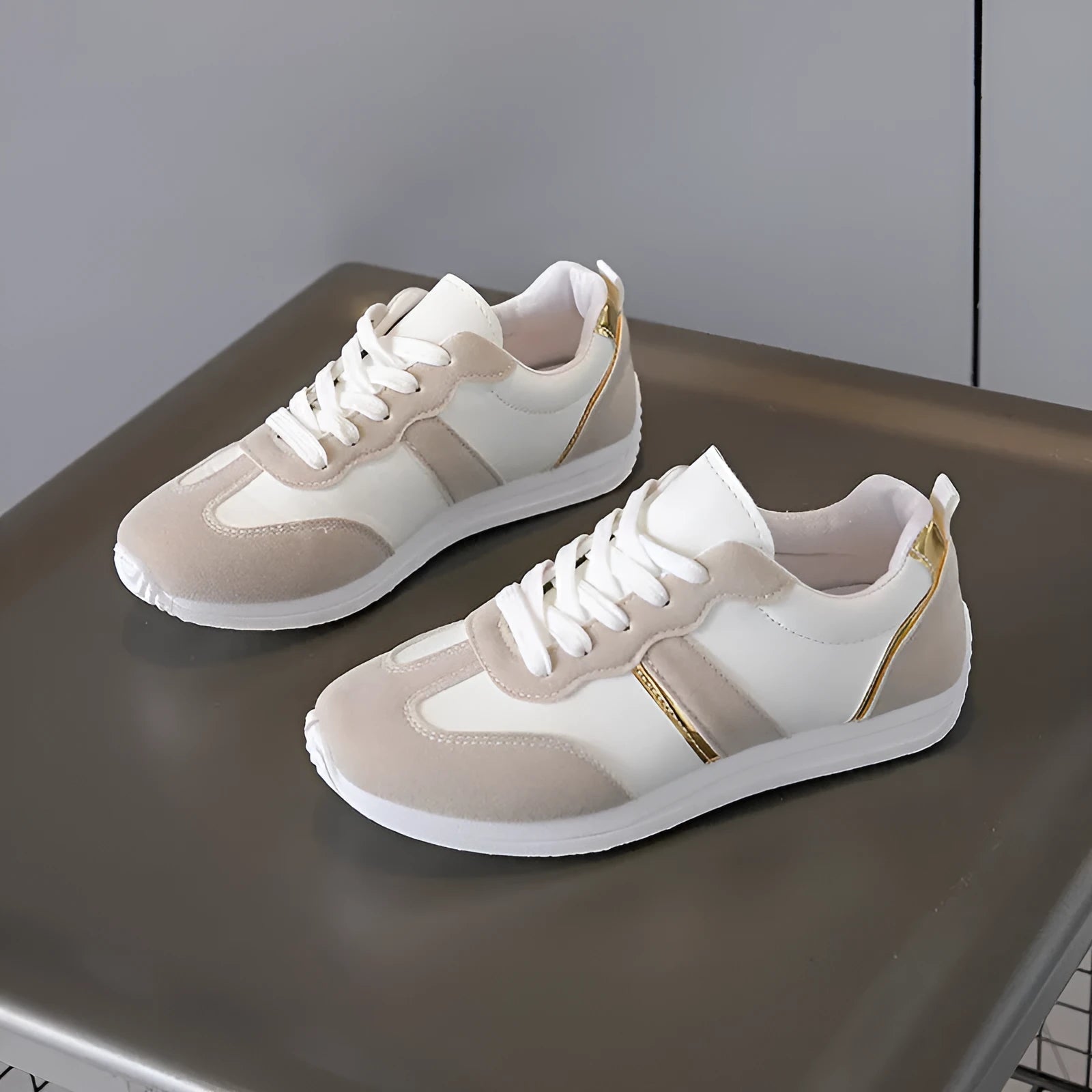 Women's casual flat sports shoes in grey with fabric canvas upper and PVC sole, low-top design