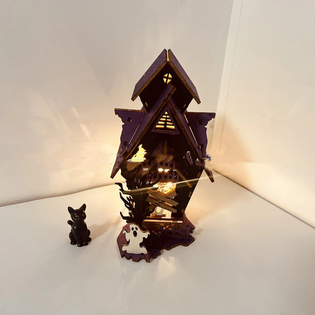 DIY wooden glowing haunted house Halloween table decoration and candlestick holder.