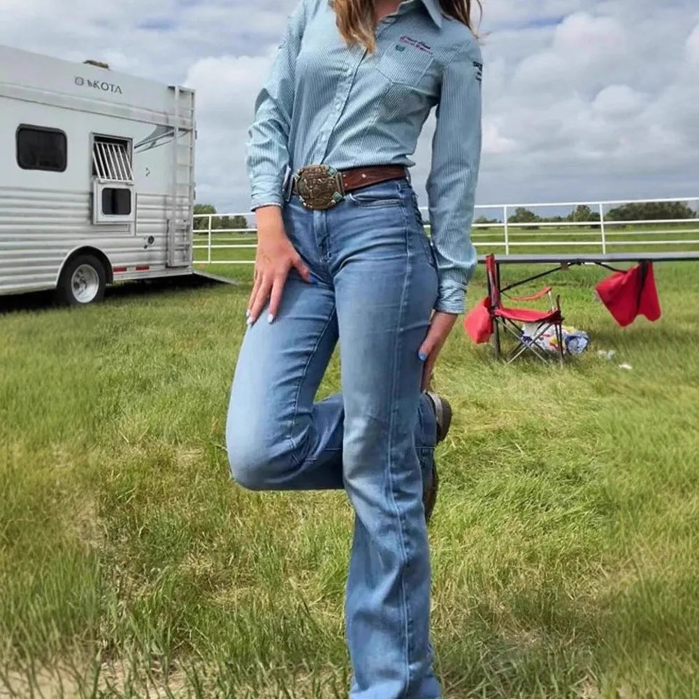 Blue embroidered slim-fit denim jeans with a slight flare and zip fly on a mid-waist.