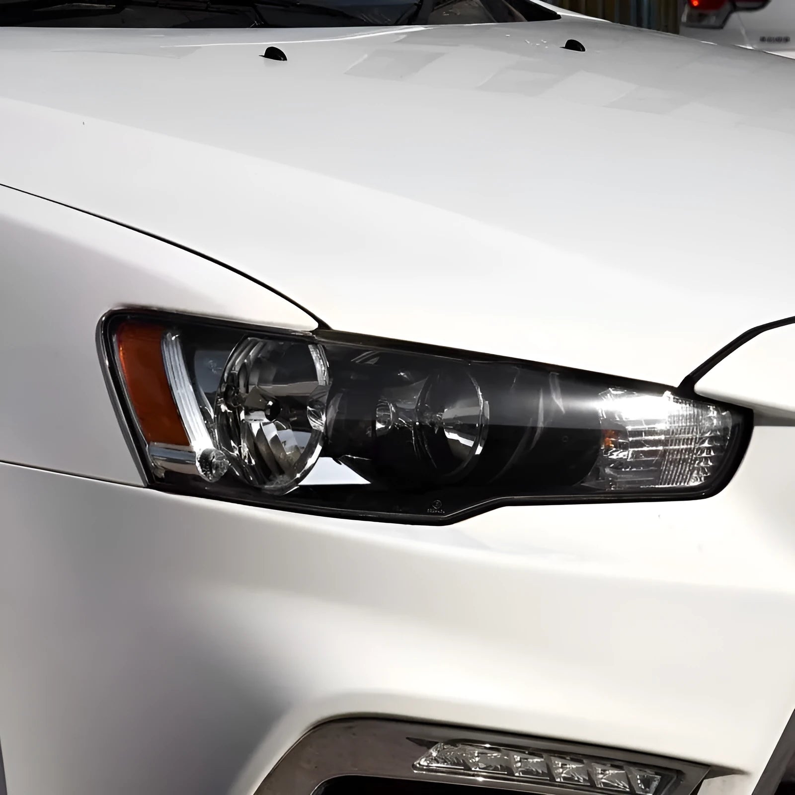 Transparent plastic car headlight housing cover showing 50mm by 30mm dimensions