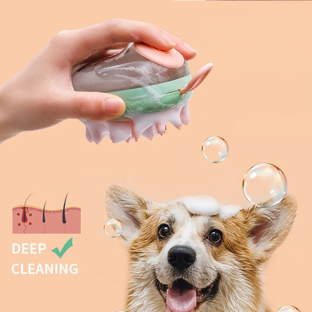 Blue 2-in-1 pet bathing brush with silicone head and integrated shampoo dispenser held in a hand.