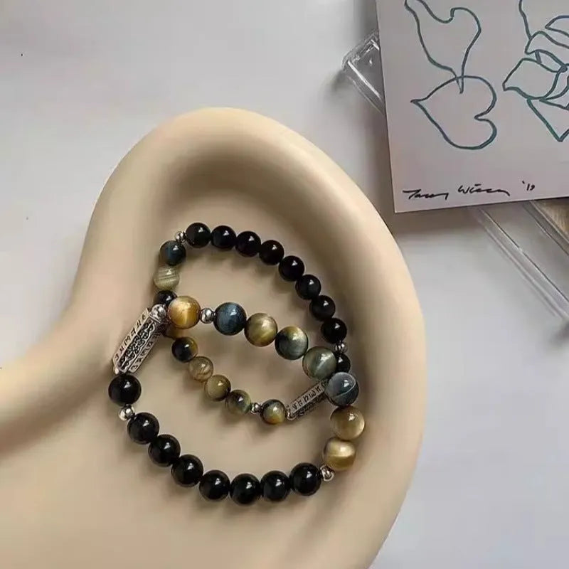 Sterling silver couple bracelet with tigereye obsidian gemstones and six words mantra design.