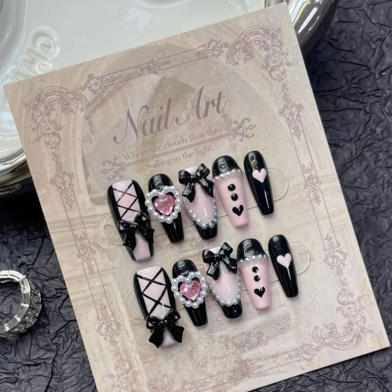 Black pink heart hand-painted artificial nails with bow patterns and cat's eye finish